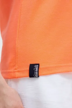 Basic Poloshirt aus Pikee mit Backprint electric orange