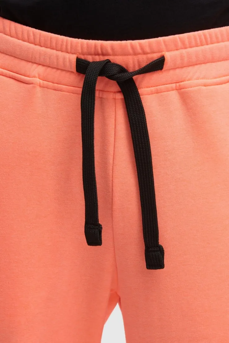 Jogginghose mit Logo Print speed orange neon